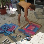 Spraypainting the boxes with stencils